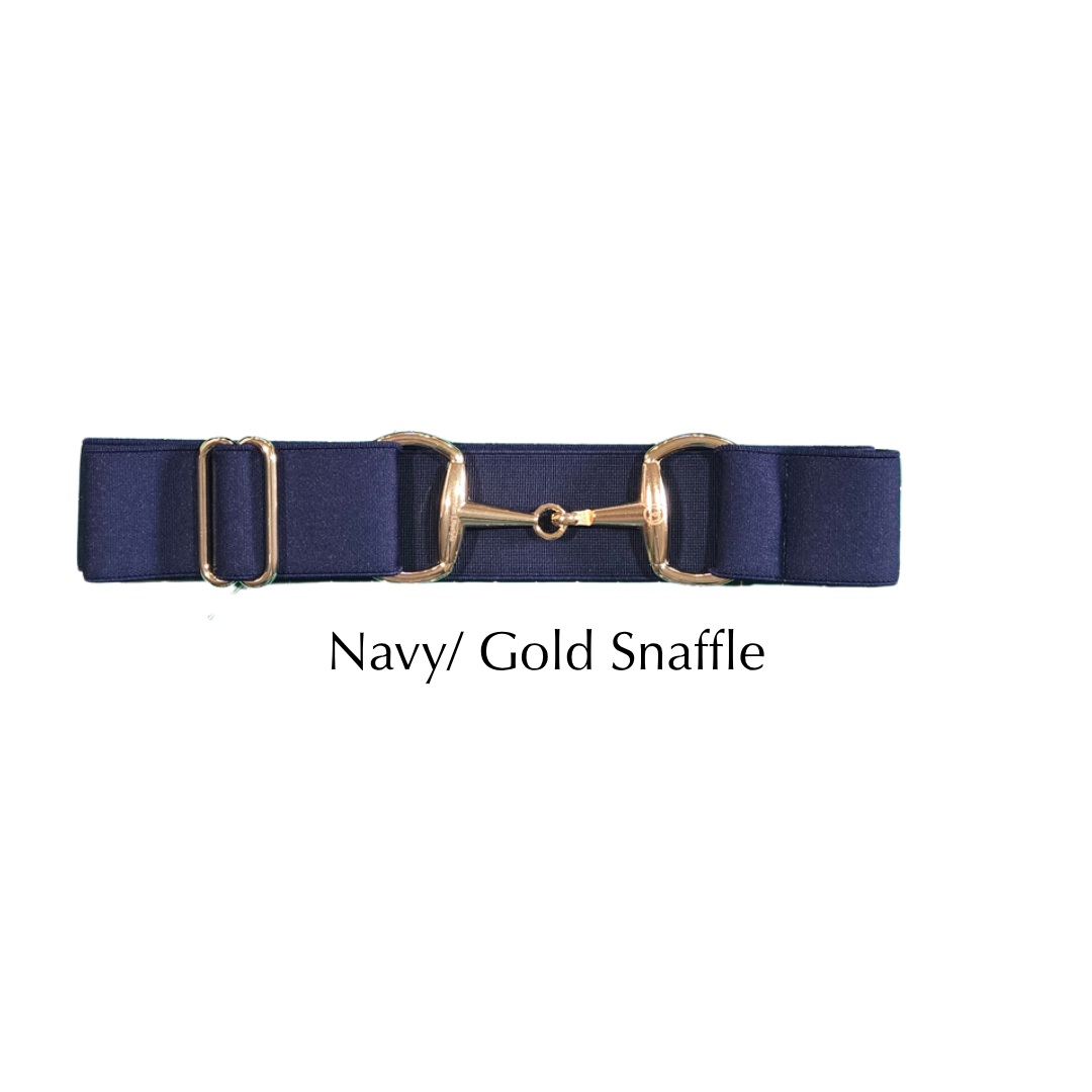 A navy blue fabric snaffle belt with polished gold-tone metal hardware, shown against a plain white background with the text 'Navy/ Gold Snaffle' underneath.