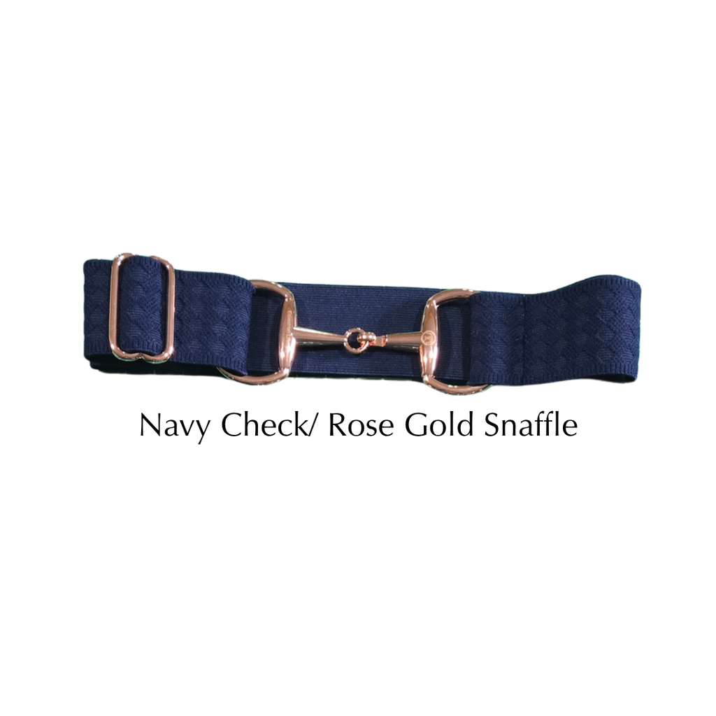 A navy blue checkered equestrian girth with a rose gold horse bit snaffle, displayed on a clean white background with the text 'Navy Check/ Rose Gold Snaffle' underneath.