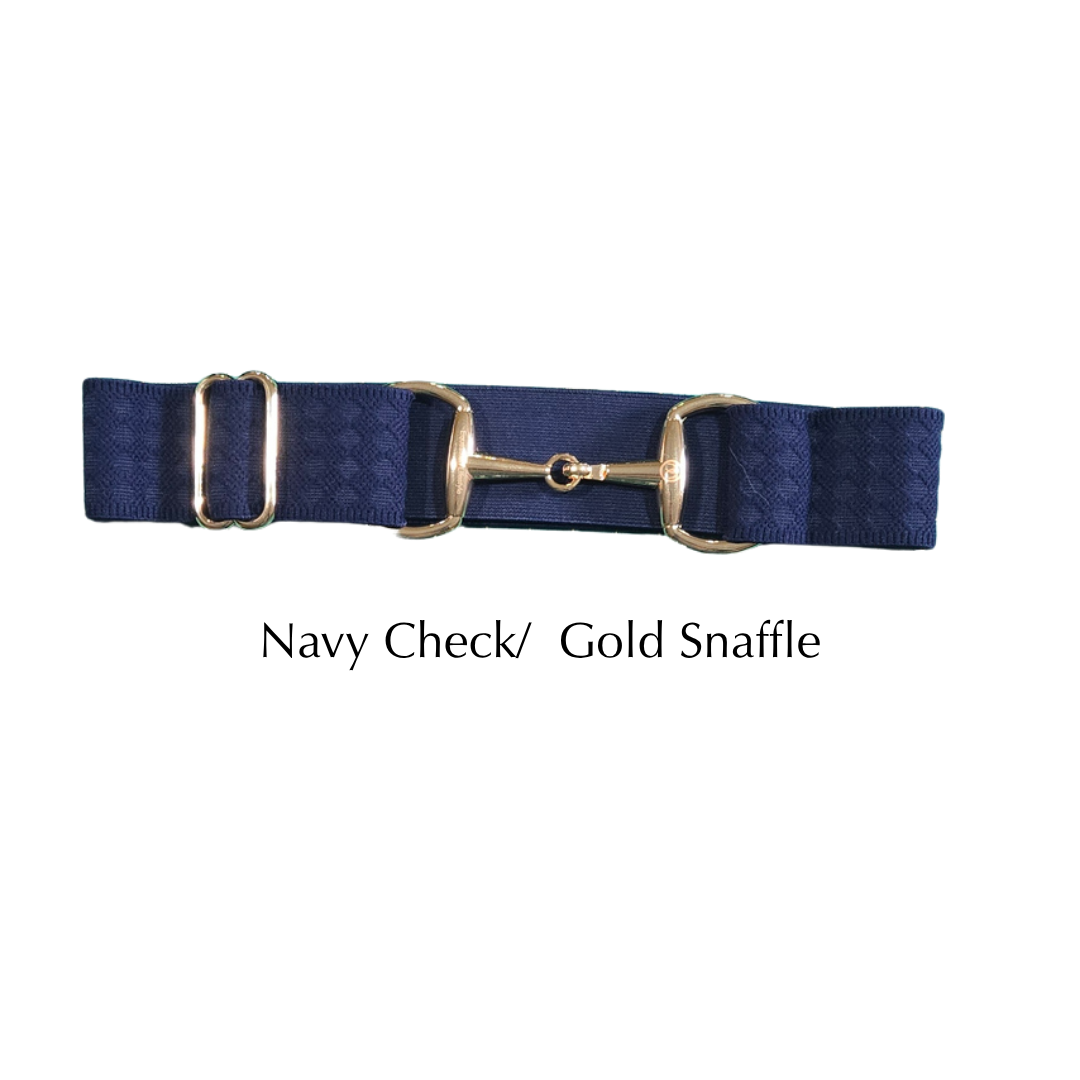 A navy blue checkered equestrian snaffle belt with a gold-tone metal snaffle and D-rings, shown against a plain white background with the text 'Navy Check/ Gold Snaffle' below it.