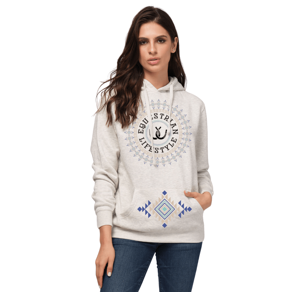 A woman modeling a light heather gray hoodie with a circular 'equestrian Lifestyle' graphic on the chest and a blue and yellow geometric pattern on the front pocket, paired with blue jeans against a plain white background.