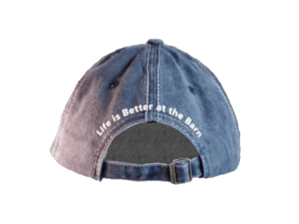 A washed blue denim baseball cap shown from the back, featuring the white embroidered text 'Life is Better at the Barn' on the crown and an adjustable snapback closure.