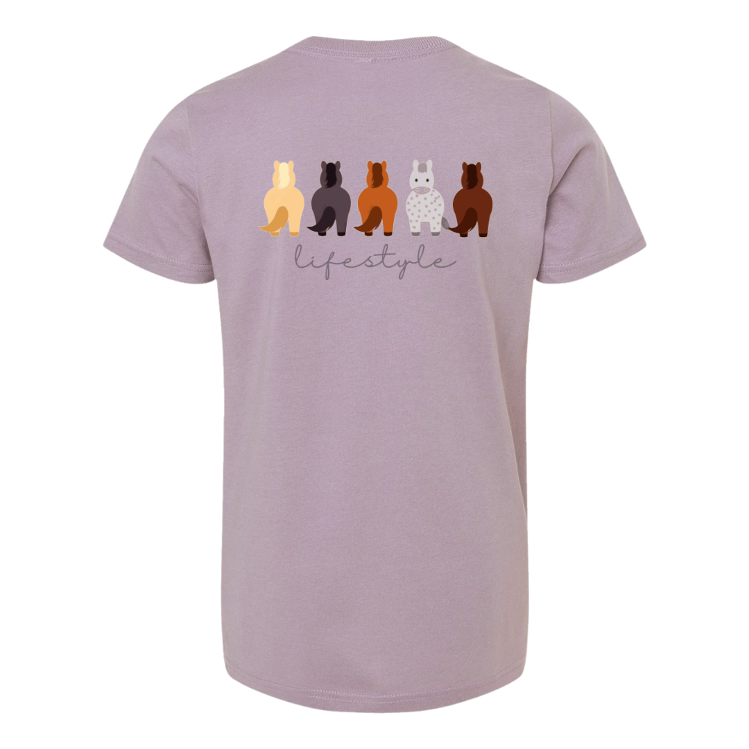 A light purple short-sleeve t-shirt shown from the back, featuring a graphic of five stylized horses in various colors above the word 'lifestyle' in gray script.