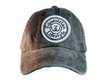 A distressed baseball cap with a brown-to-gray gradient wash, featuring a circular white embroidered patch on the front that reads 'Equestrian Lifestyle'.