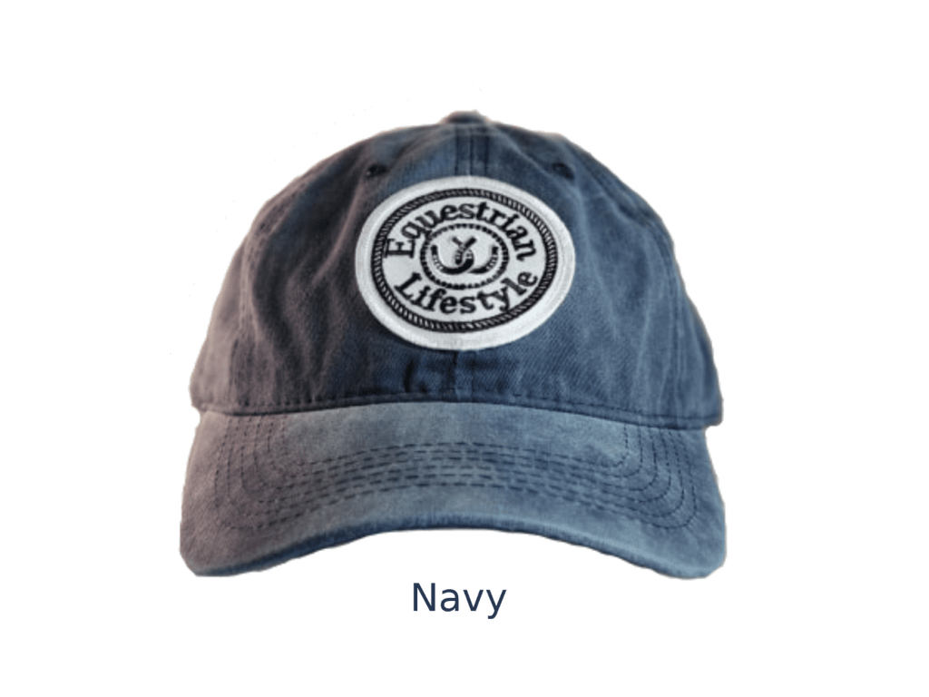 A navy blue washed cotton baseball cap with a circular embroidered patch on the front that reads 'Equestrian Lifestyle' in black text on a white background. The word 'Navy' is printed below the hat on a plain white background.