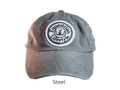A gray baseball cap with a circular embroidered patch reading 'Equestrian Lifestyle' on the front, shown against a plain white background with the word 'Steel' below.
