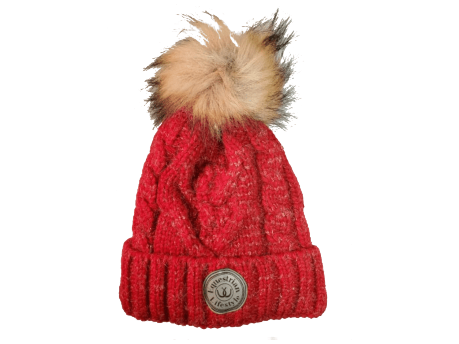 A red cable-knit beanie hat featuring a fluffy tan and brown faux-fur pom-pom on top and a circular leatherette equestrian lifestyle brand badge on the front cuff.