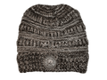 A marled knit beanie hat in black and white, featuring horizontal textured stripes and a circular leatherette equestrian lifestyle brand patch on the front cuff.