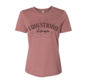 A women's short-sleeve crewneck t-shirt in heathered dusty rose pink, featuring a dark brown graphic on the chest with the words 'EQUESTRIAN Lifestyle' and a horseshoe design.