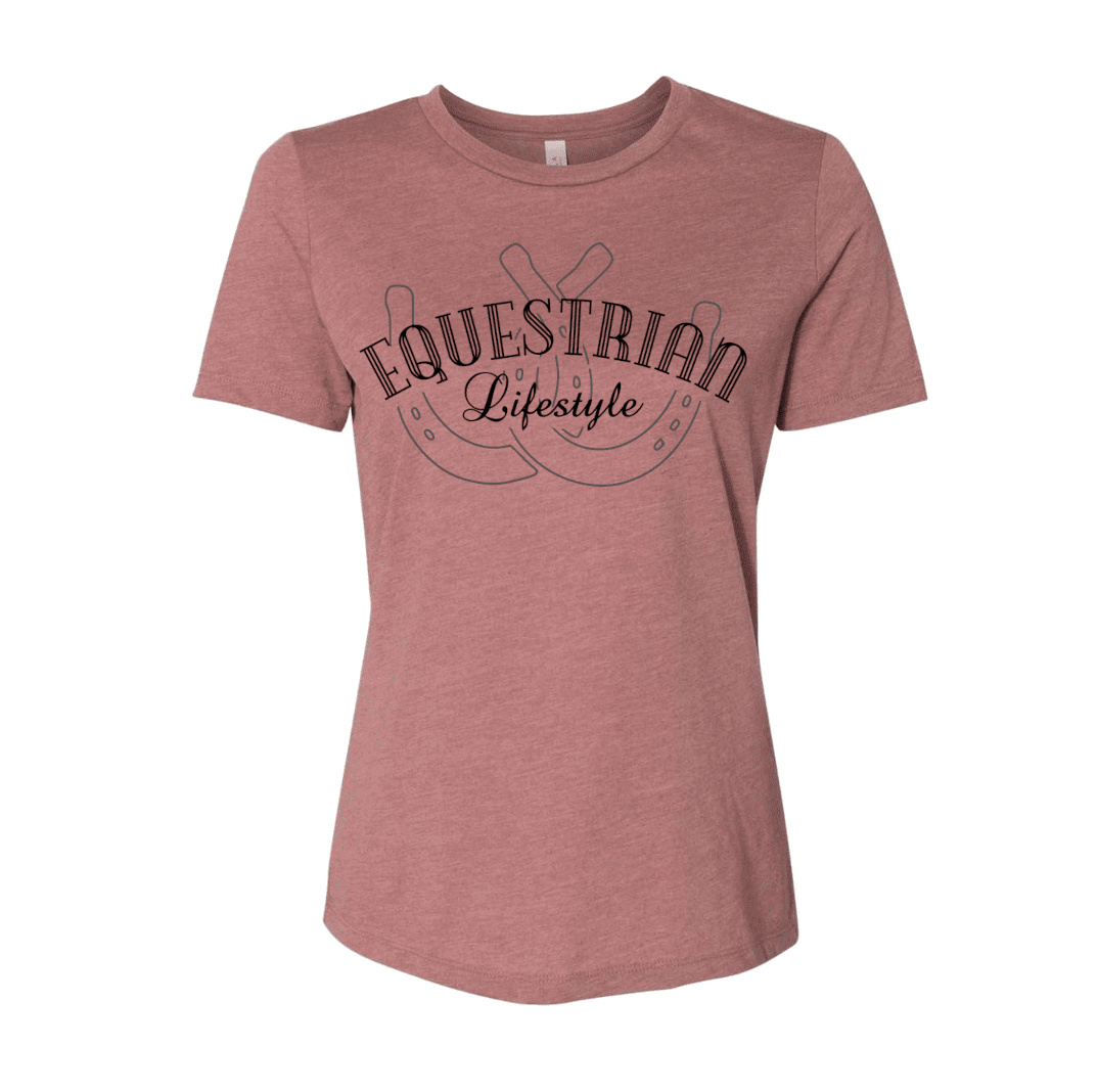 A women's short-sleeve crewneck t-shirt in heathered dusty rose pink, featuring a dark brown graphic on the chest with the words 'EQUESTRIAN Lifestyle' and a horseshoe design.