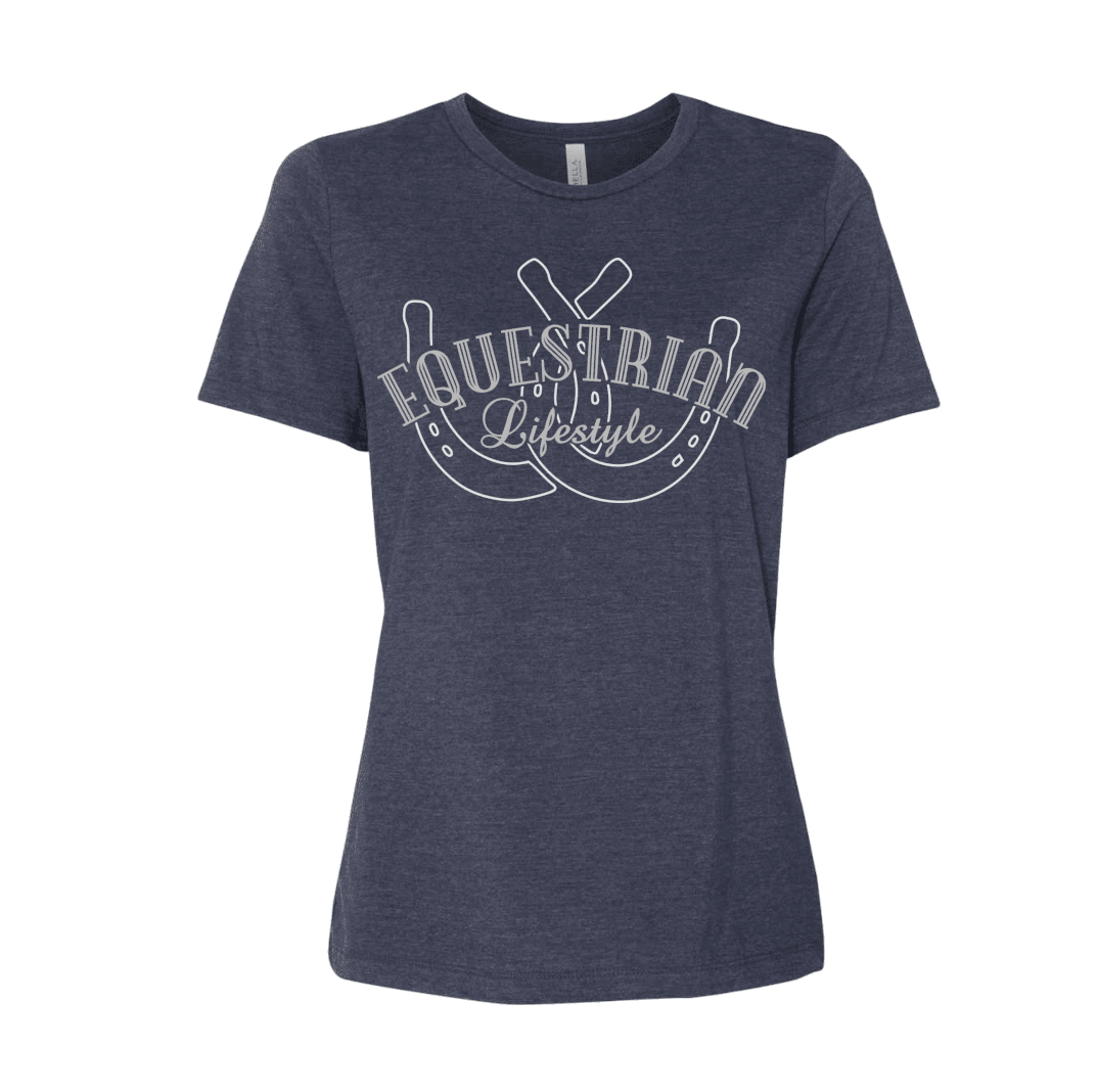 A women's short-sleeve crewneck t-shirt in heathered navy blue, featuring a white graphic print on the front with the words 'EQUESTRIAN Lifestyle'  over a horseshoe design, shown against a plain white background.