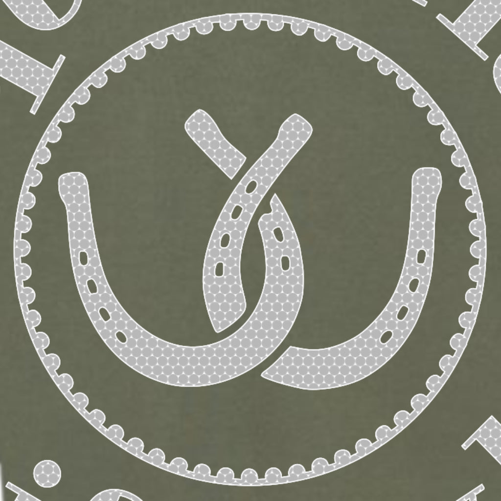 A close-up of the front design pattern featuring a white horseshoe and interlocking loops motif inside a scalloped circular border on an olive green background.