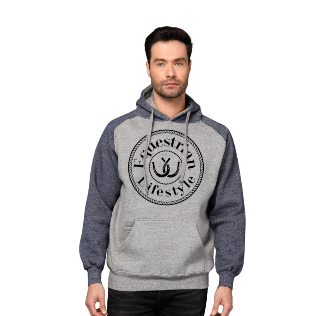 A man wearing a heather gray and navy blue raglan hoodie with a black circular graphic on the chest that reads 'Equestrian Lifestyle' with a horseshoe symbol, 