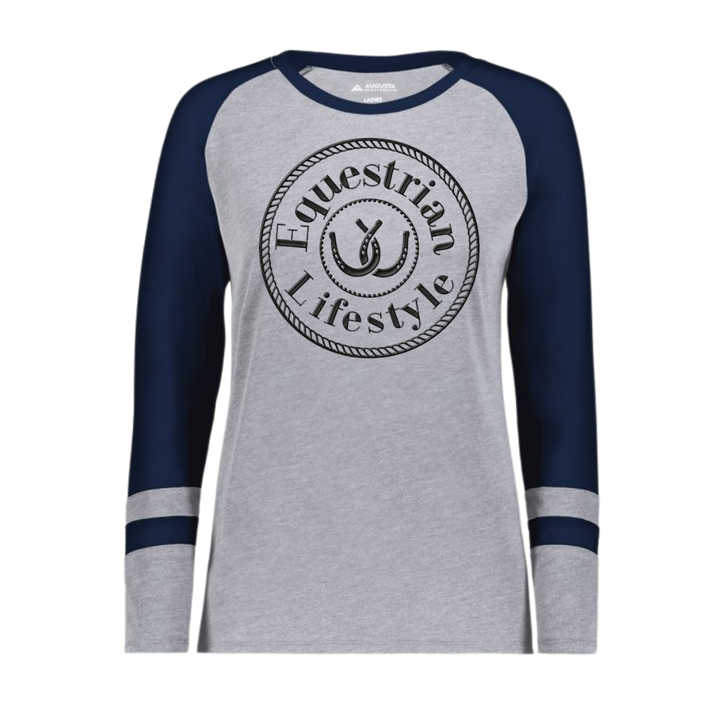 A women's long-sleeve raglan t-shirt in heather gray and navy blue, featuring a black circular 'Equestrian Lifestyle' graphic on the chest with a horseshoe