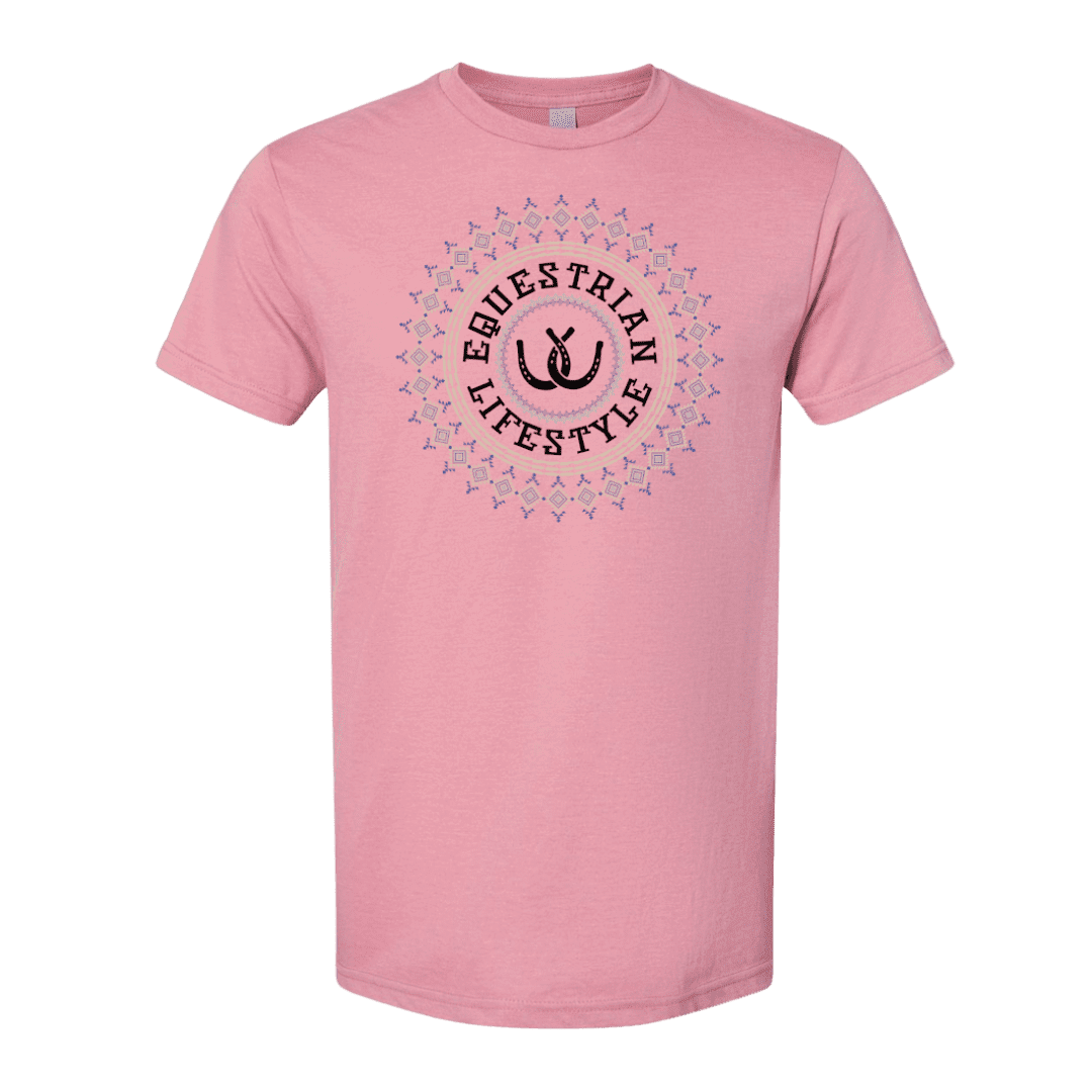 A pink short-sleeve crewneck t-shirt featuring a circular graphic on the chest with the words 'EQUESTRIAN LIFESTYLE' in black, surrounded by a decorative aztec pattern 