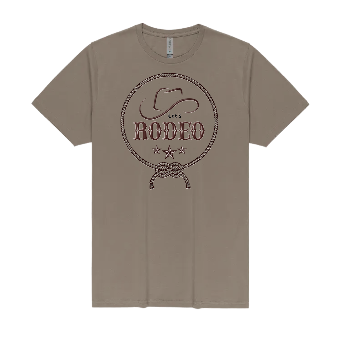 A taupe brown short-sleeve crewneck t-shirt featuring a dark brown graphic on the chest with a cowboy hat, rope border, and the text 'Let's RODEO' with three stars.