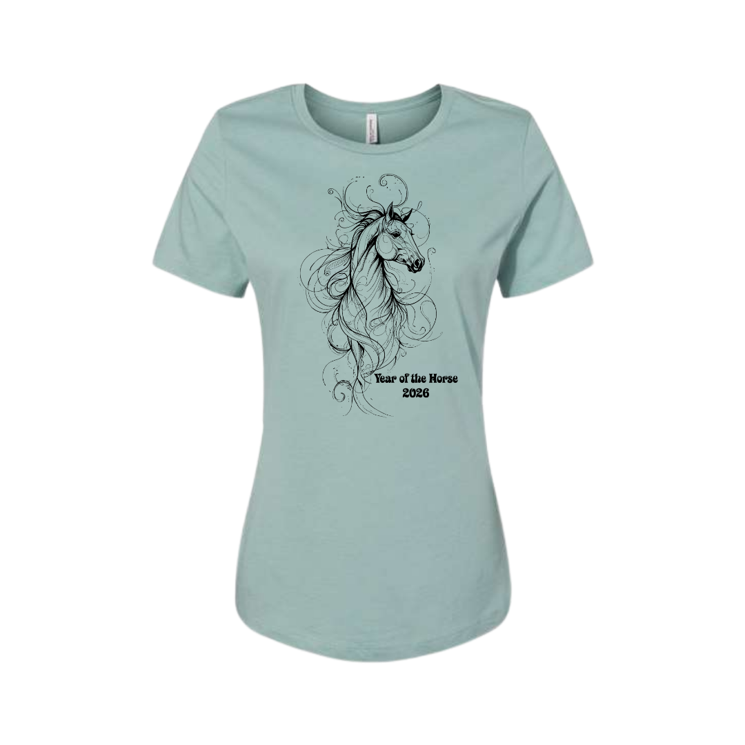 A light blue-green short-sleeve t-shirt with a black line art graphic of a horse with flowing hair and the text 'Year of the Horse 2026' printed on the front, displayed on a clean white background.