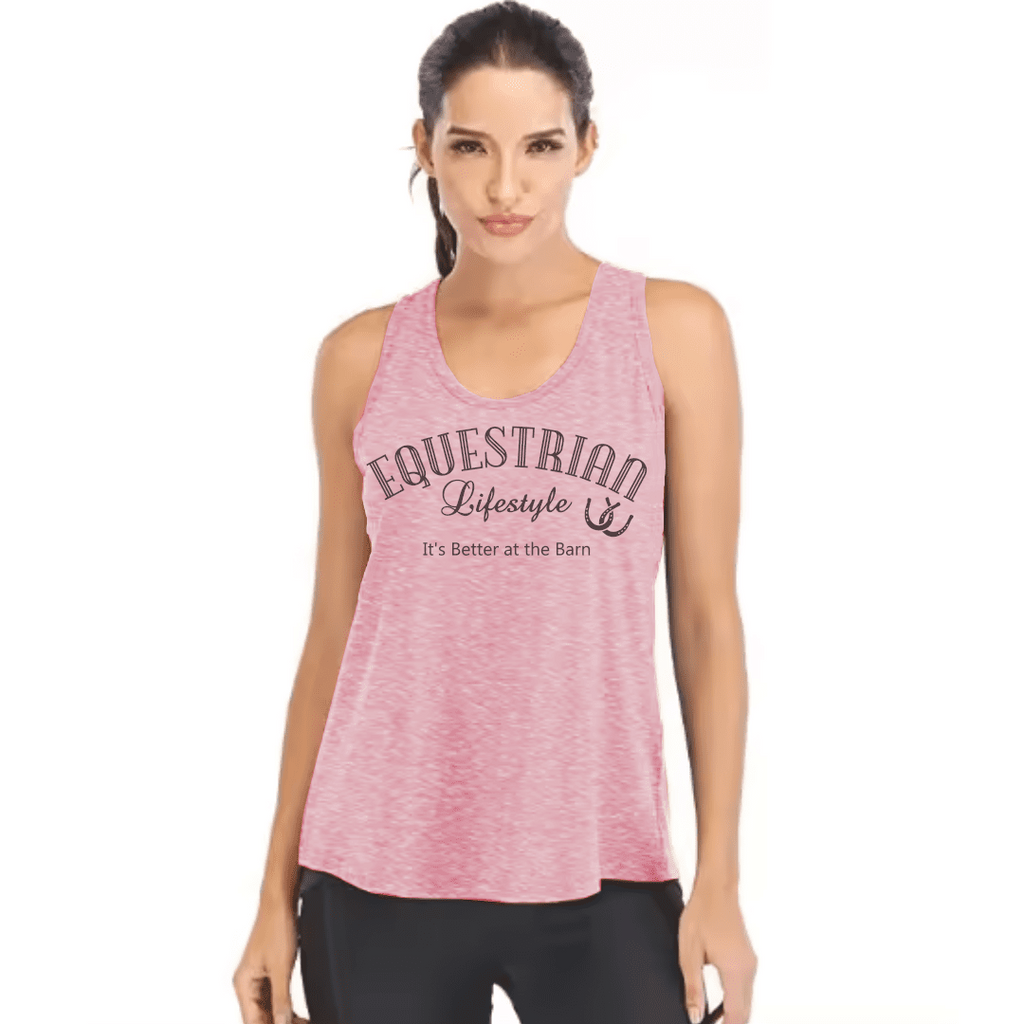A woman modeling a heather pink sleeveless tank top with 'EQUESTRIAN Lifestyle' and 'It's Better at the Barn' printed on the front, paired with black leggings against a plain white background.