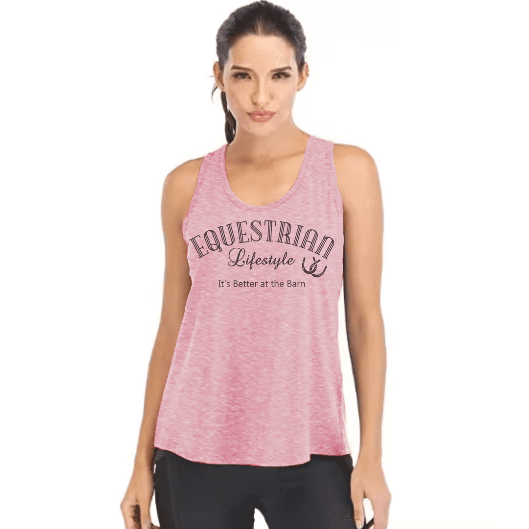 A woman modeling a heather pink sleeveless tank top with 'EQUESTRIAN Lifestyle' and 'It's Better at the Barn' printed on the front, paired with black leggings against a plain white background.