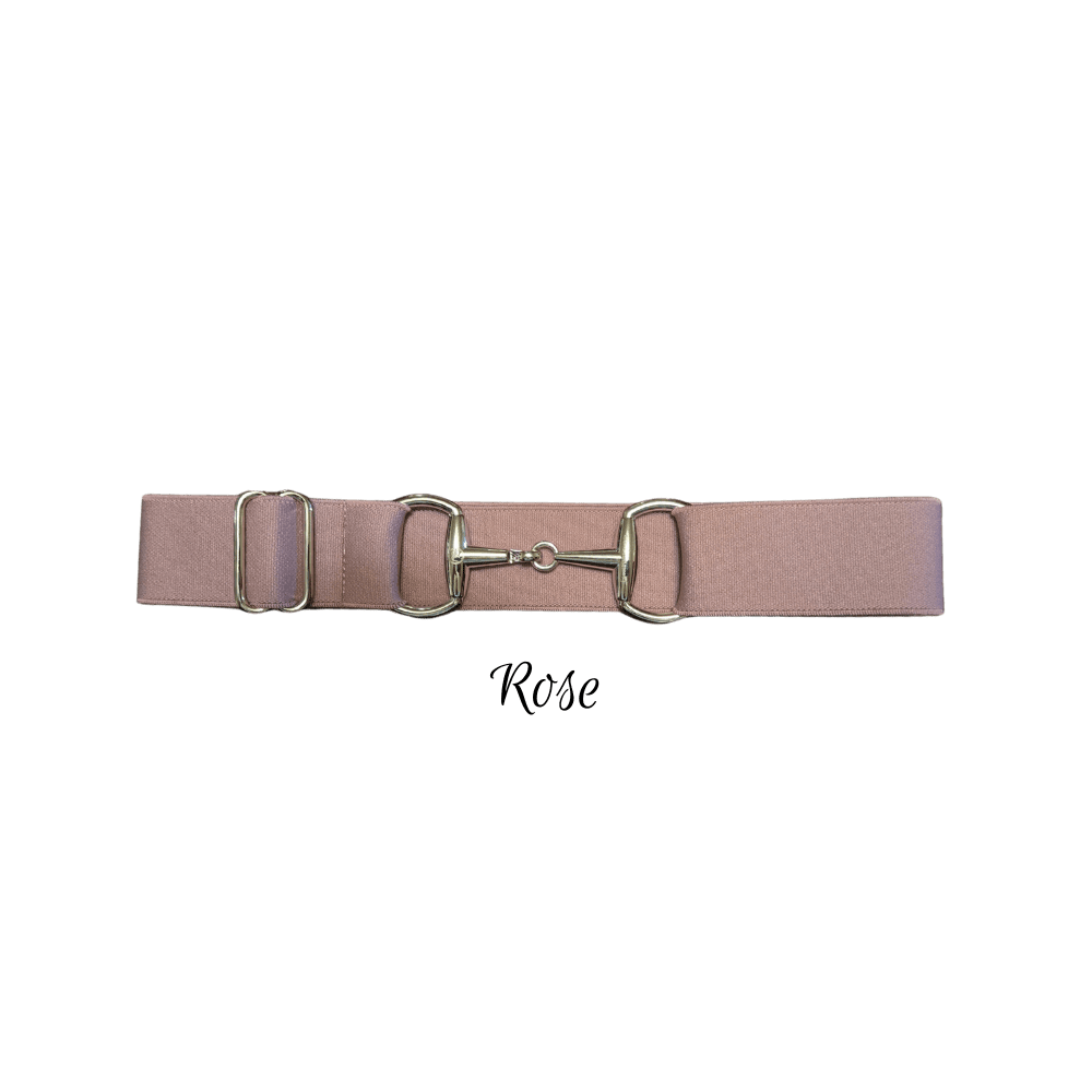 A dusty rose pink leather belt with a polished silver-tone metal horsebit closure, displayed horizontally on a solid white background with the text 'Rose' written below.