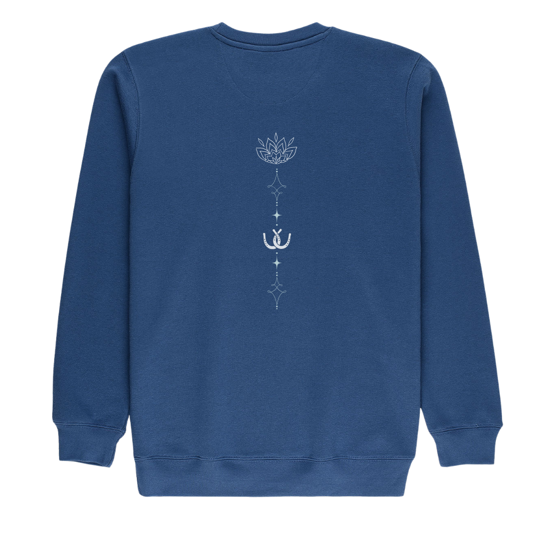 A blue crewneck sweatshirt shown from the back, featuring a vertical white graphic print of a lotus flower, a small horseshoe, and decorative symbols.